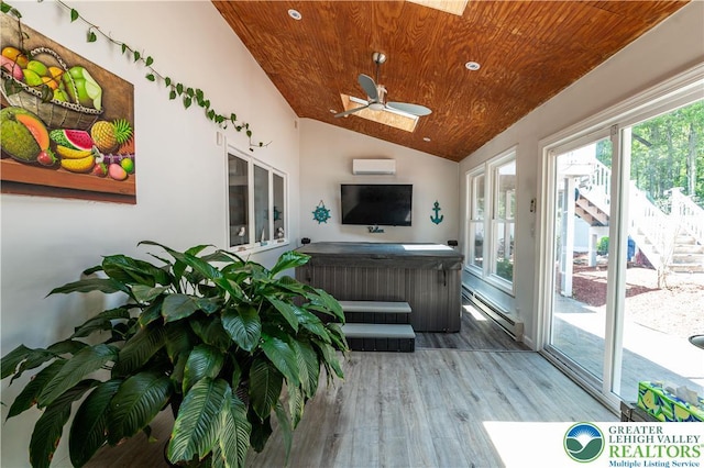 1555 Longleaf Dr, Chestnuthill Twp, PA 18330 - sunroom / solarium featuring a hot tub, wood finished floors, wood ceiling, a wall mounted air conditioner, and vaulted ceiling