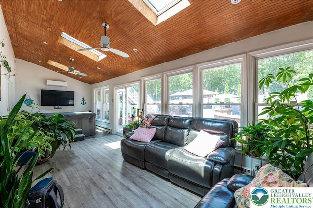 1555 Longleaf Dr, Chestnuthill Twp, PA 18330 - sunroom featuring a skylight, a hot tub, lofted ceiling, a wall unit AC, and baseboard heating
