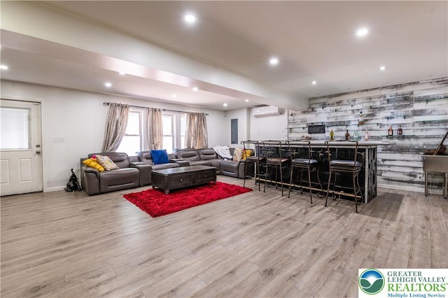 1555 Longleaf Dr, Chestnuthill Twp, PA 18330 - living area featuring a wall mounted air conditioner, wood finished floors, recessed lighting, an accent wall, and bar