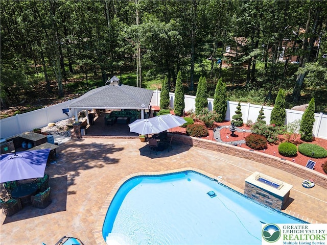 1555 Longleaf Dr, Chestnuthill Twp, PA 18330 - view of pool featuring a gazebo, a patio area, a fenced backyard, and outdoor dining space