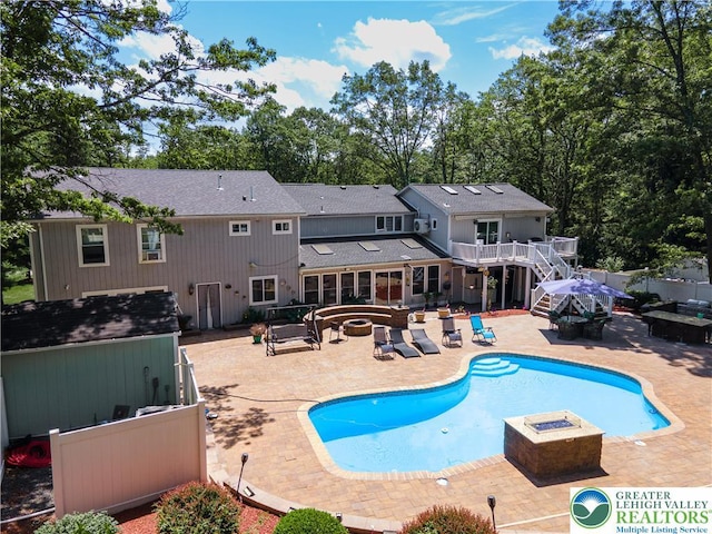 1555 Longleaf Dr, Chestnuthill Twp, PA 18330 - view of pool featuring a fire pit, a hot tub, and a patio area