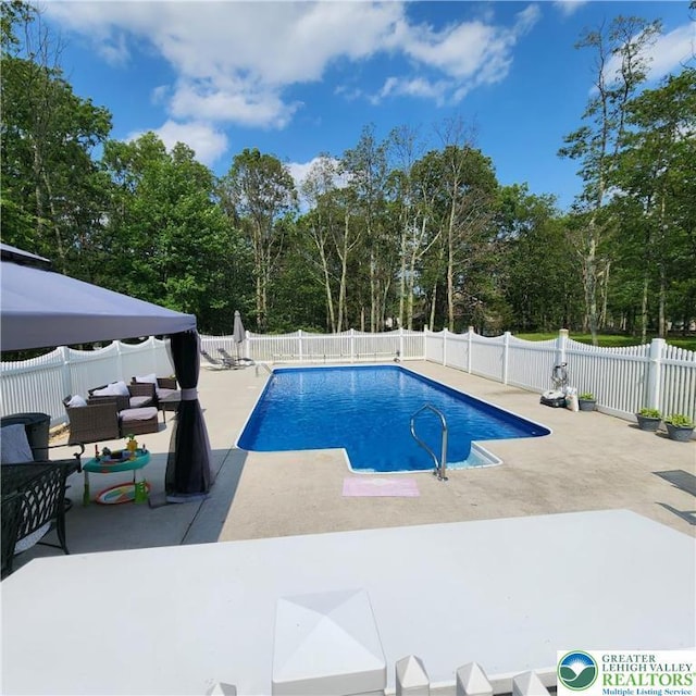 408 Sassafrass Way, Jackson Twp, PA 18360 - view of swimming pool with a patio, a fenced backyard, and view of scattered trees