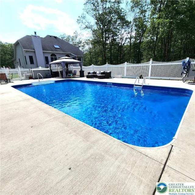 408 Sassafrass Way, Jackson Twp, PA 18360 - view of pool featuring a gazebo, a patio area, an outdoor living space, and a fenced backyard