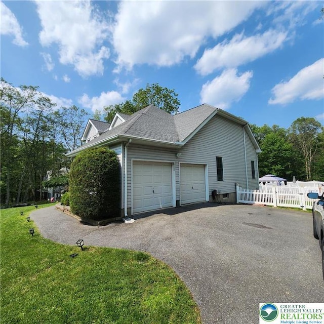 408 Sassafrass Way, Jackson Twp, PA 18360 - view of property exterior featuring asphalt driveway, an attached garage, and a shingled roof