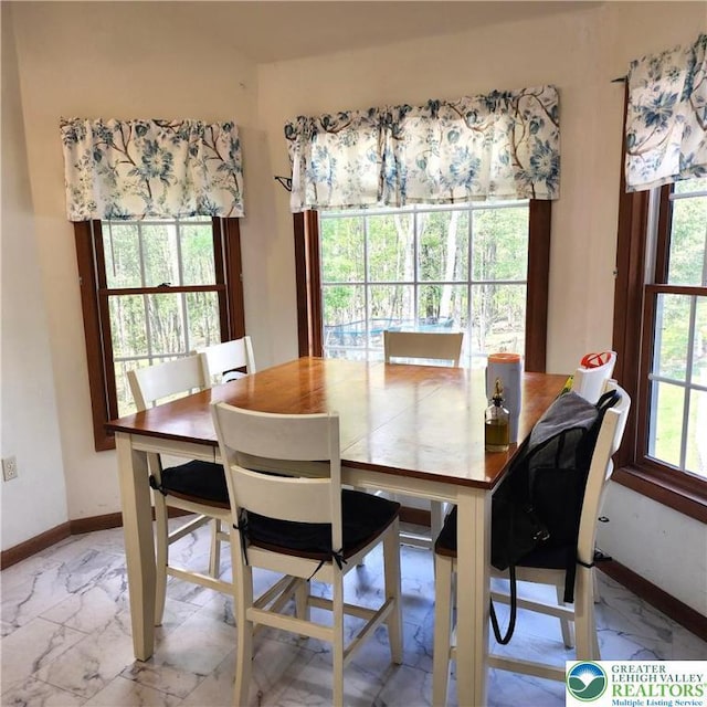 408 Sassafrass Way, Jackson Twp, PA 18360 - dining space with marble finish floors and baseboards