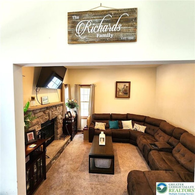 408 Sassafrass Way, Jackson Twp, PA 18360 - living room featuring carpet floors and a stone fireplace