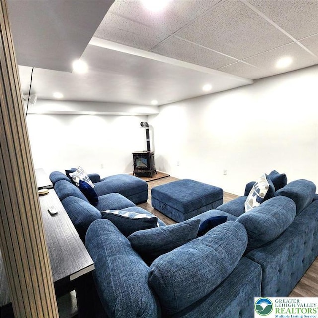 408 Sassafrass Way, Jackson Twp, PA 18360 - living room featuring a wood stove, wood finished floors, and recessed lighting