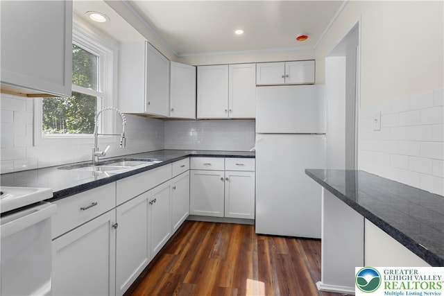 35 N 3rd St, Bangor Boro, PA 18013 - kitchen featuring freestanding refrigerator, stove, white cabinetry, decorative backsplash, and recessed lighting