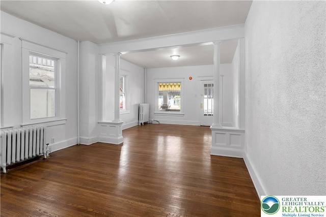 35 N 3rd St, Bangor Boro, PA 18013 - spare room featuring ornate columns, radiator, hardwood / wood-style floors, and a textured wall