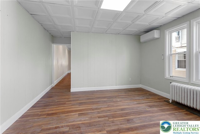 35 N 3rd St, Bangor Boro, PA 18013 - unfurnished room with wood finished floors, a wall mounted air conditioner, and radiator