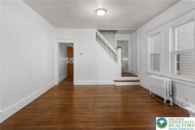 35 N 3rd St, Bangor Boro, PA 18013 - empty room featuring radiator heating unit, stairway, and wood finished floors