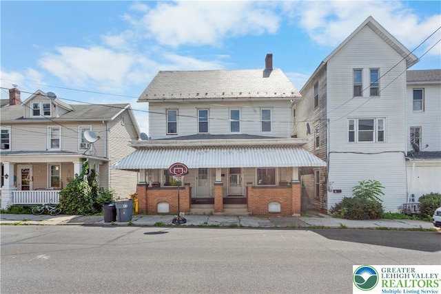 35 N 3rd St, Bangor Boro, PA 18013 - view of front of property with a porch, brick siding, and a chimney