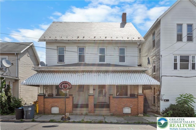 35 N 3rd St, Bangor Boro, PA 18013 - view of front of house featuring brick siding, a high end roof, a chimney, and covered porch