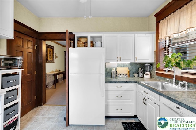 14 S 14th St, Easton, PA 18042 - kitchen with white appliances, white cabinetry, backsplash, and light tile patterned floors