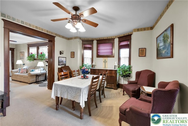 14 S 14th St, Easton, PA 18042 - dining space with light colored carpet, ceiling fan, and plenty of natural light