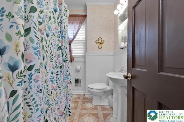 14 S 14th St, Easton, PA 18042 - bathroom featuring wainscoting, ornamental molding, tile patterned flooring, and curtained shower