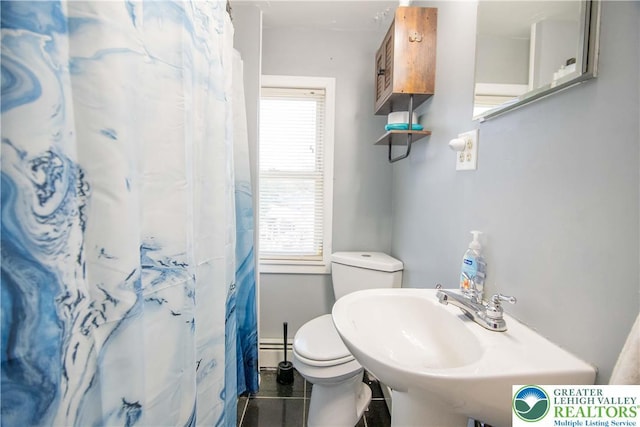 1666 Newport Ave, Northampton Boro, PA 18067 - bathroom with plenty of natural light, baseboard heating, and a shower with shower curtain