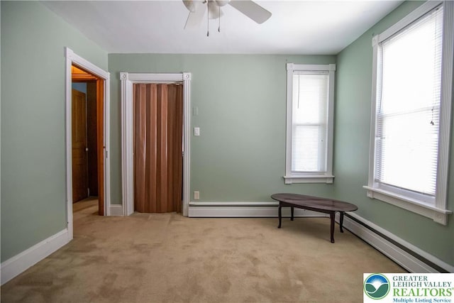1666 Newport Ave, Northampton Boro, PA 18067 - unfurnished bedroom with carpet, multiple windows, a baseboard radiator, and a ceiling fan