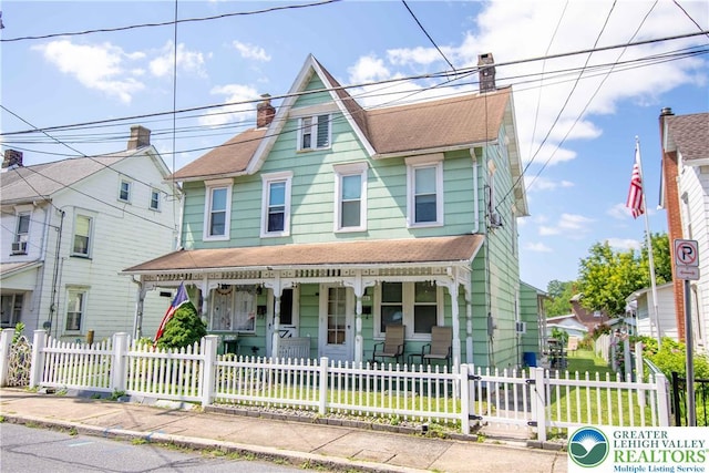 1666 Newport Ave, Northampton Boro, PA 18067 - victorian-style house with a porch, a chimney, a fenced front yard, and roof with shingles