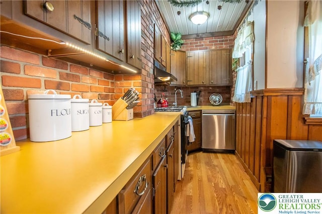 1666 Newport Ave, Northampton Boro, PA 18067 - kitchen with dishwasher, black range oven, under cabinet range hood, light countertops, and light wood-style flooring