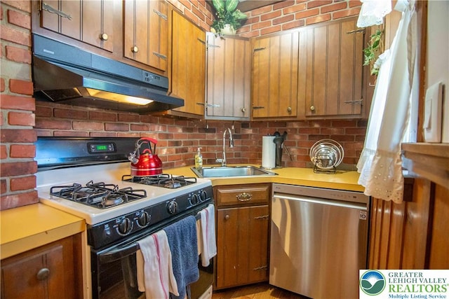 1666 Newport Ave, Northampton Boro, PA 18067 - kitchen featuring range with gas cooktop, stainless steel dishwasher, under cabinet range hood, brown cabinets, and light countertops