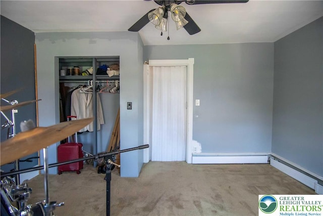 1666 Newport Ave, Northampton Boro, PA 18067 - bedroom with carpet, a baseboard heating unit, a closet, and a ceiling fan