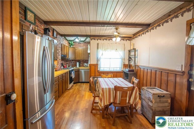 1666 Newport Ave, Northampton Boro, PA 18067 - kitchen featuring stainless steel appliances, light wood-style flooring, wainscoting, light countertops, and brown cabinets