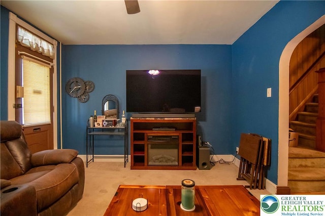 1666 Newport Ave, Northampton Boro, PA 18067 - carpeted living area featuring stairway, a ceiling fan, and arched walkways