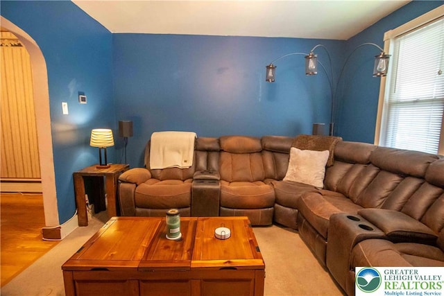 1666 Newport Ave, Northampton Boro, PA 18067 - home theater room with arched walkways, a baseboard radiator, and wood finished floors