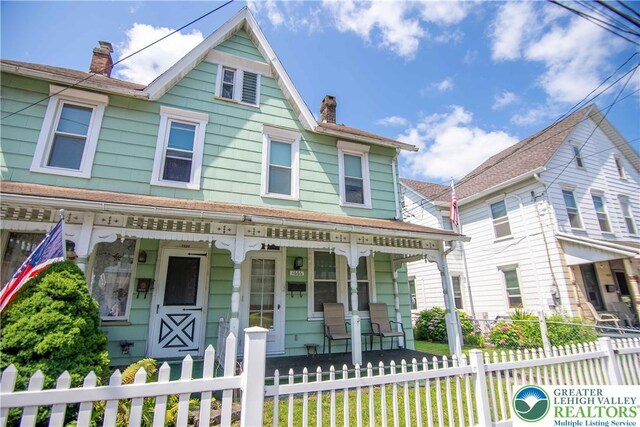 1666 Newport Ave, Northampton Boro, PA 18067 - view of front of property featuring a porch, a chimney, and a fenced front yard