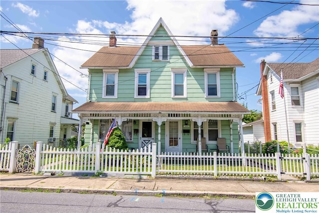 1666 Newport Ave, Northampton Boro, PA 18067 - victorian-style house with covered porch, a fenced front yard, a chimney, and roof with shingles