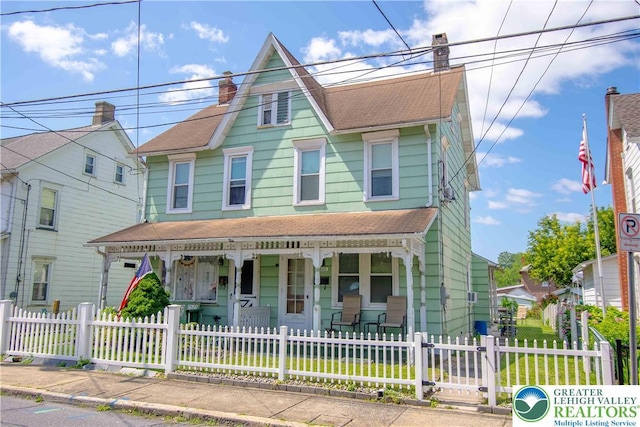 1666 Newport Ave, Northampton Boro, PA 18067 - view of front facade with covered porch, a chimney, a shingled roof, and a fenced front yard