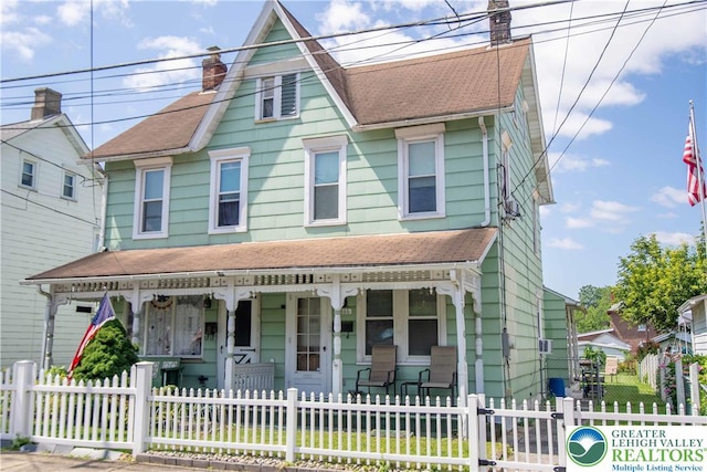 1666 Newport Ave, Northampton Boro, PA 18067 - view of front of house featuring a porch, a chimney, a shingled roof, and a fenced front yard