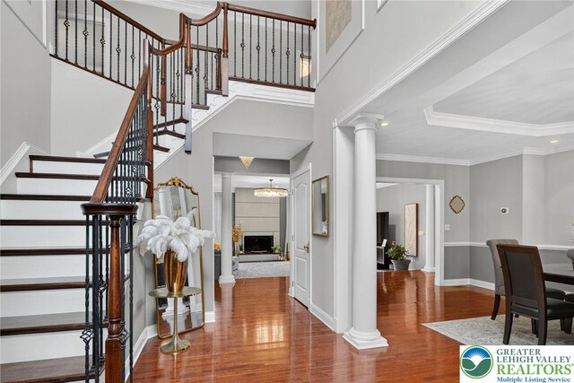 4508 Homestead Dr, Lower Nazareth Twp, PA 18064 - foyer featuring decorative columns, wood finished floors, stairway, and ornamental molding