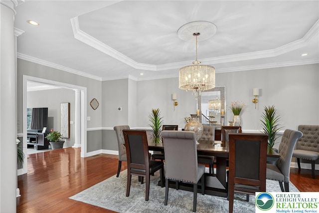4508 Homestead Dr, Lower Nazareth Twp, PA 18064 - dining area featuring a raised ceiling, a chandelier, wood finished floors, recessed lighting, and crown molding