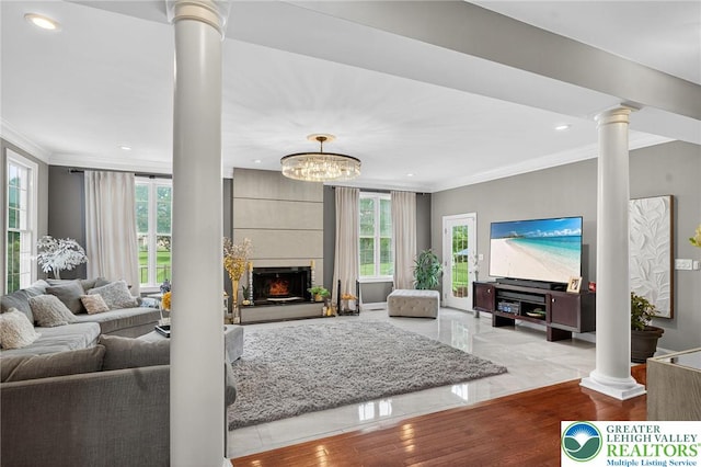 4508 Homestead Dr, Lower Nazareth Twp, PA 18064 - living area featuring decorative columns, ornamental molding, recessed lighting, and a fireplace