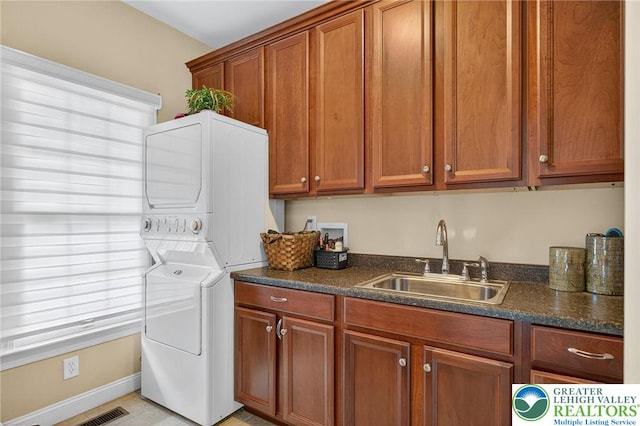 4508 Homestead Dr, Lower Nazareth Twp, PA 18064 - laundry area featuring estacked washer and dryer and cabinet space