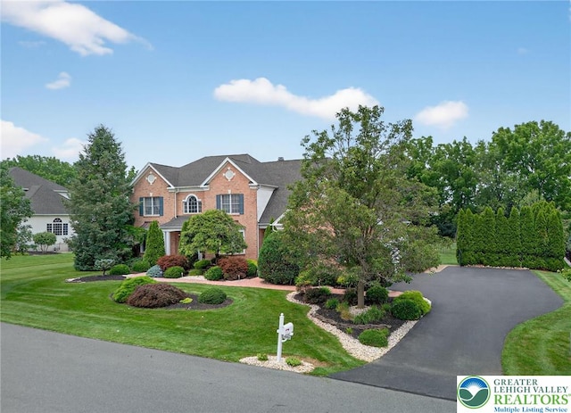 4508 Homestead Dr, Lower Nazareth Twp, PA 18064 - view of front facade with a front lawn, asphalt driveway, and brick siding