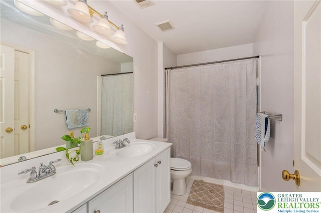 232 S 33rd St, South Whitehall Twp, PA 18104 - bathroom with double vanity and tile patterned floors