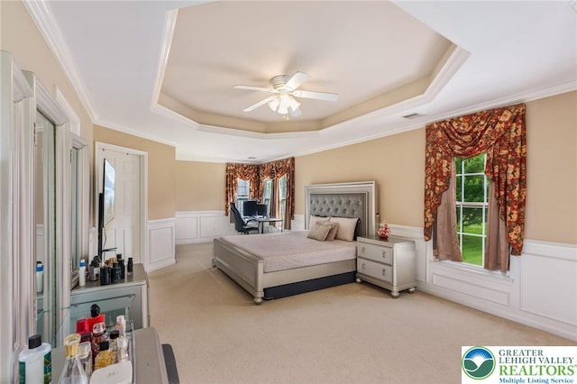 232 S 33rd St, South Whitehall Twp, PA 18104 - bedroom featuring a tray ceiling, a decorative wall, light carpet, a wainscoted wall, and ornamental molding