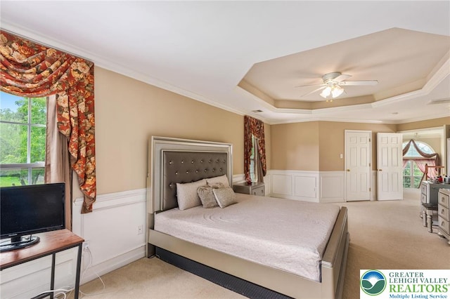 232 S 33rd St, South Whitehall Twp, PA 18104 - bedroom with a tray ceiling, carpet floors, a wainscoted wall, crown molding, and a ceiling fan