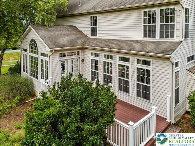 232 S 33rd St, South Whitehall Twp, PA 18104 - back of property with a deck and a shingled roof