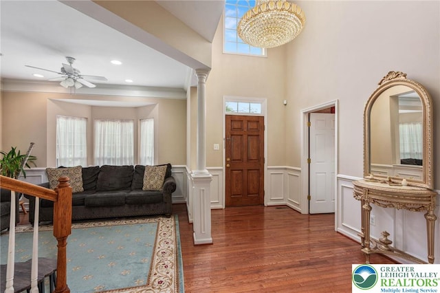 232 S 33rd St, South Whitehall Twp, PA 18104 - entrance foyer featuring ornate columns, wood finished floors, a ceiling fan, wainscoting, and ornamental molding