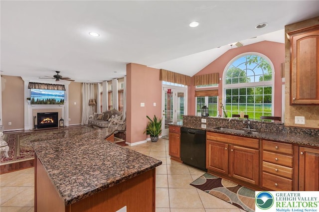 232 S 33rd St, South Whitehall Twp, PA 18104 - kitchen with dishwasher, a ceiling fan, light tile patterned flooring, vaulted ceiling, and dark stone countertops