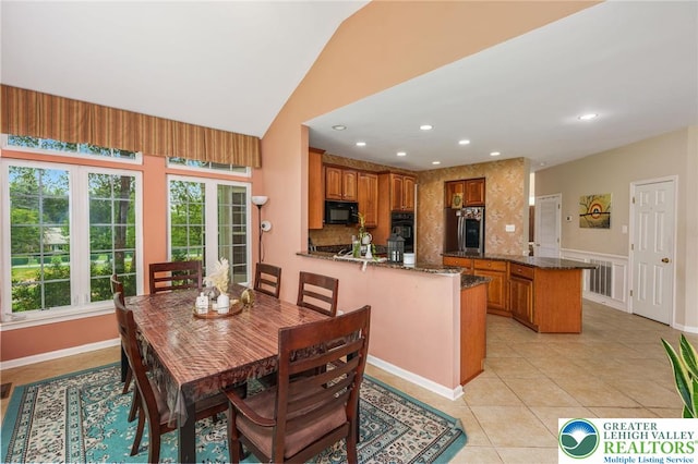 232 S 33rd St, South Whitehall Twp, PA 18104 - dining area with light tile patterned floors, recessed lighting, and lofted ceiling