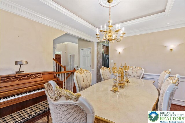 232 S 33rd St, South Whitehall Twp, PA 18104 - dining area featuring a chandelier, crown molding, a wainscoted wall, and a raised ceiling