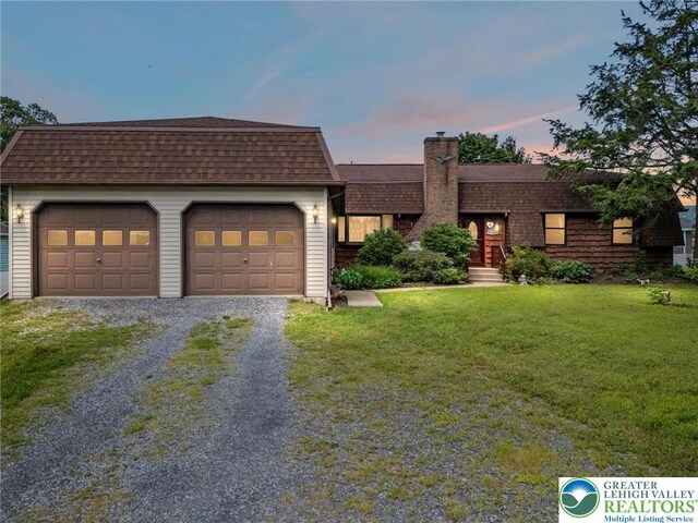7438 Rte 309, Lynn Twp, PA 18066 - view of front of property featuring driveway, a chimney, a shingled roof, a yard, and a garage