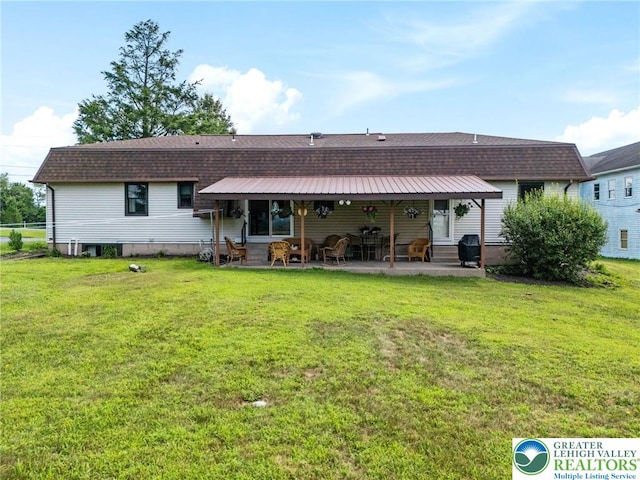 7438 Rte 309, Lynn Twp, PA 18066 - back of house with a patio, a yard, and a shingled roof