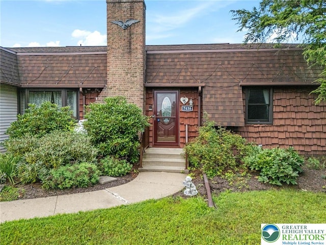 7438 Rte 309, Lynn Twp, PA 18066 - property entrance featuring roof with shingles and a chimney