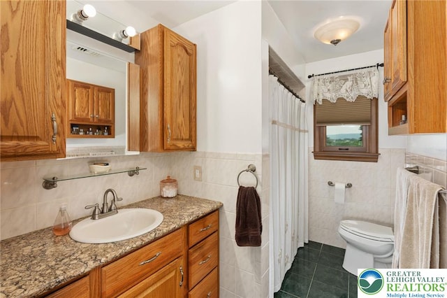 7438 Rte 309, Lynn Twp, PA 18066 - bathroom with tile walls, vanity, tile patterned floors, a wainscoted wall, and curtained shower